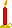 a red candle in a gold holder